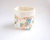 Panière de rangement bébé en tissu déco motifs feuilles multicolores créatrice Happé